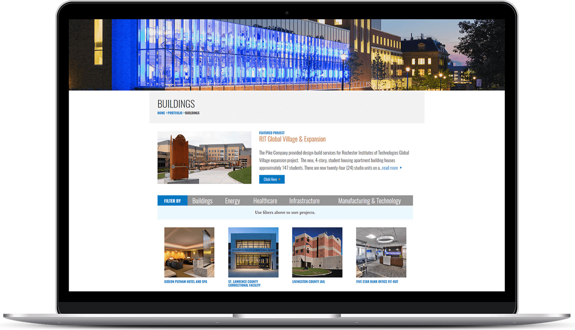 Pike Company Buildings portfolio page displayed on laptop